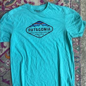 Slim fit turquoise Patagonia shirt.